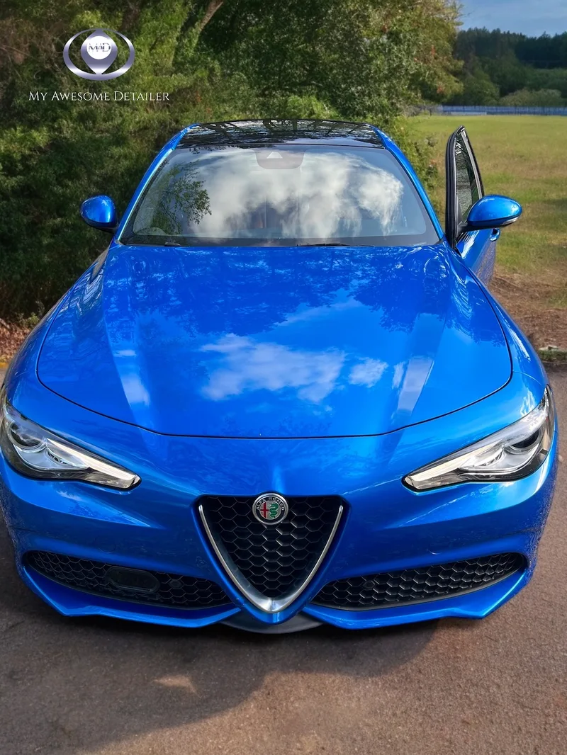 Blue Alfa Romeo Giulia detailed outdoors