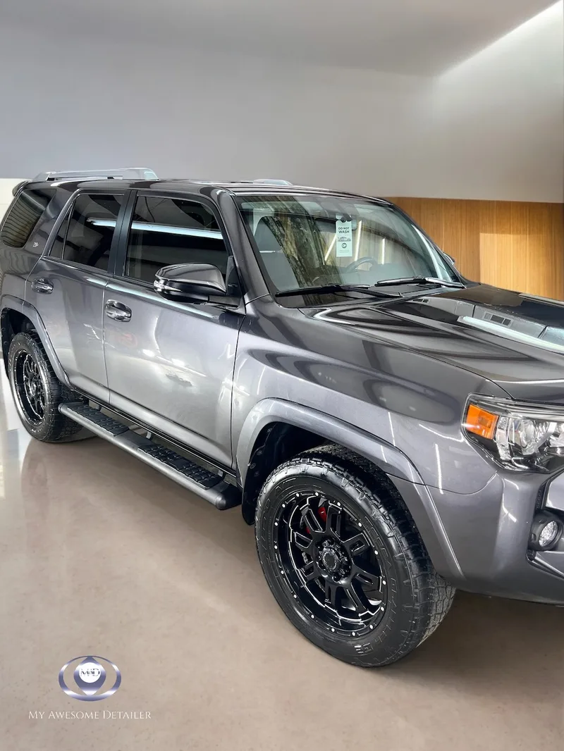 Gray Toyota 4Runner front quarter in shop