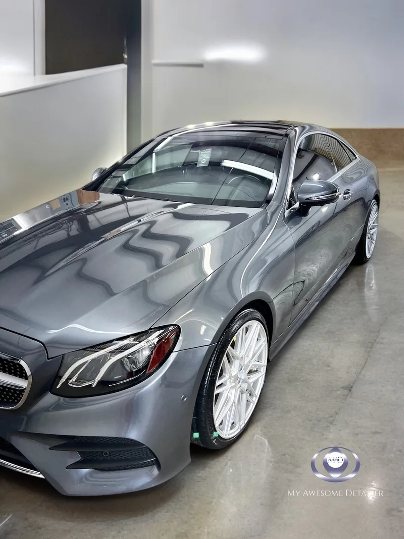 Gray Mercedes E-Class Coupe in detailing shop