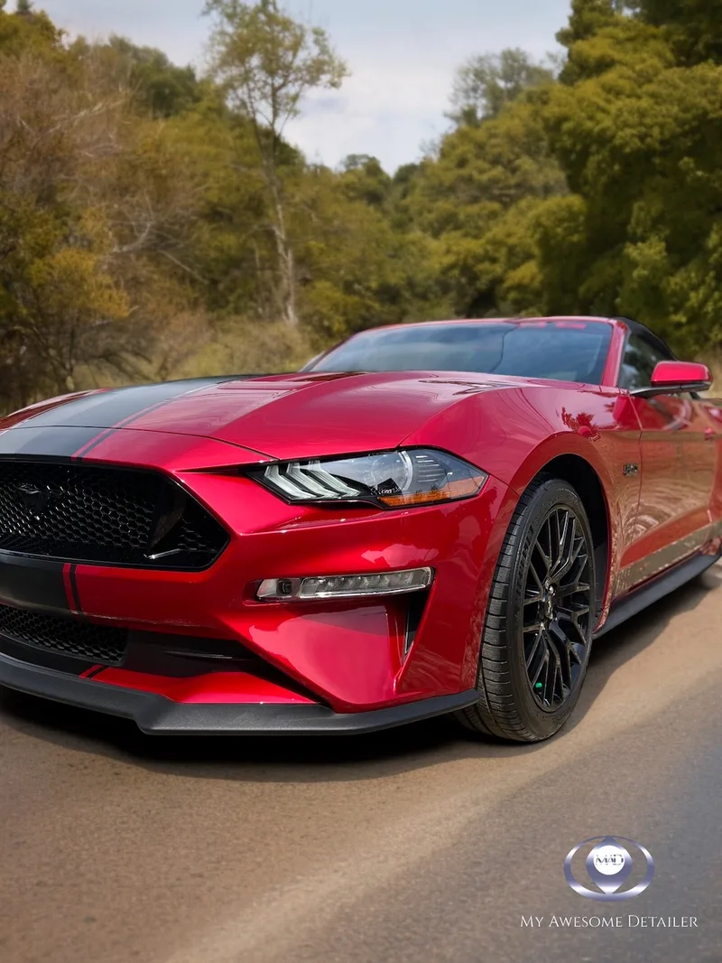 Red Ford Mustang GT convertible outdoors