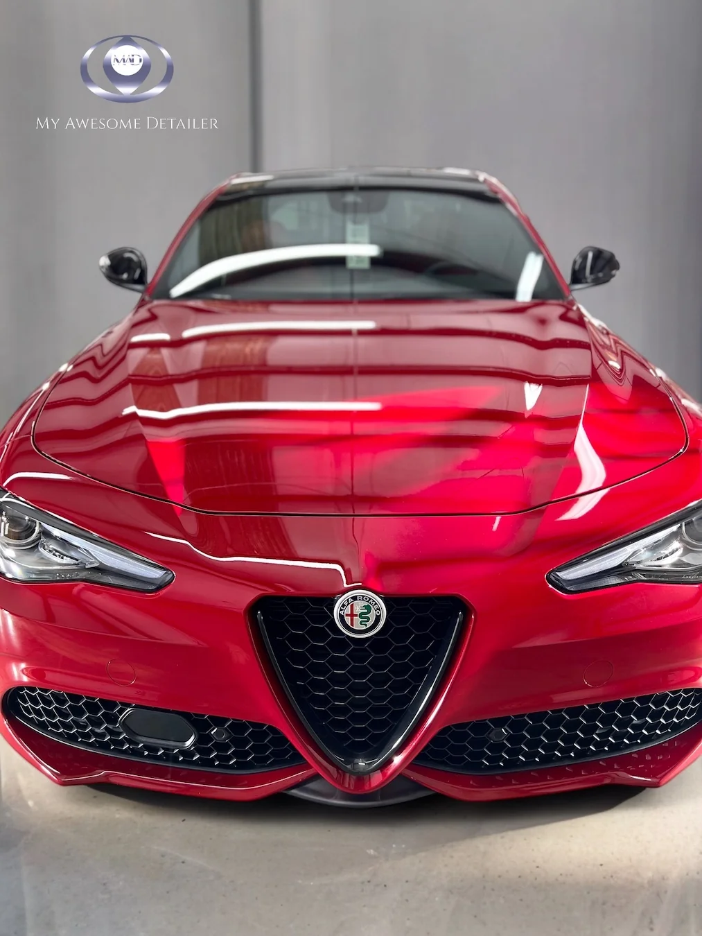 Red Alfa Romeo Giulia in shop